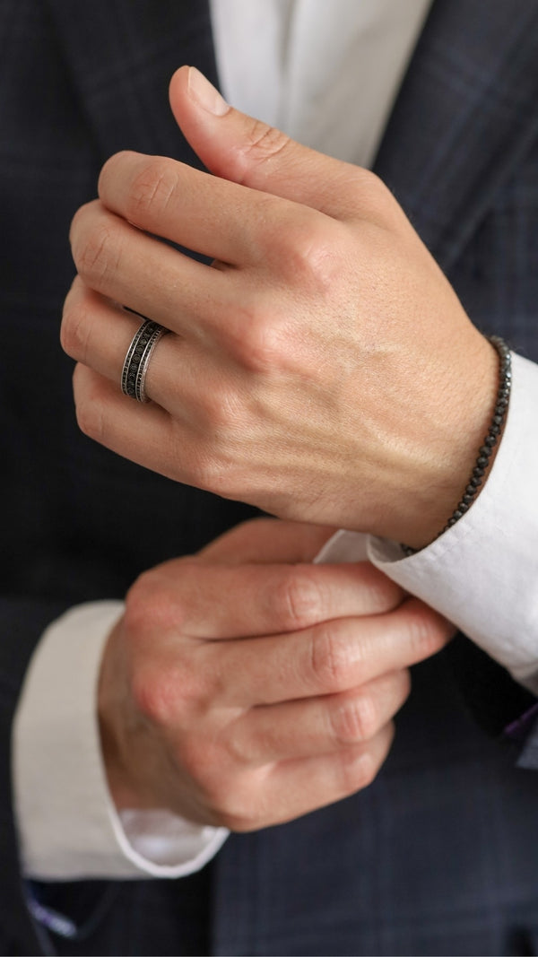 How Do You Choose Between a Traditional or Modern Men's Wedding Band Design?