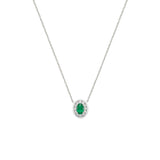 14 Karat White Gold Halo Necklace With An Emerald And Diamonds
