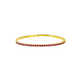 14 Karat Yellow Gold Flexible Bangle With Rubies