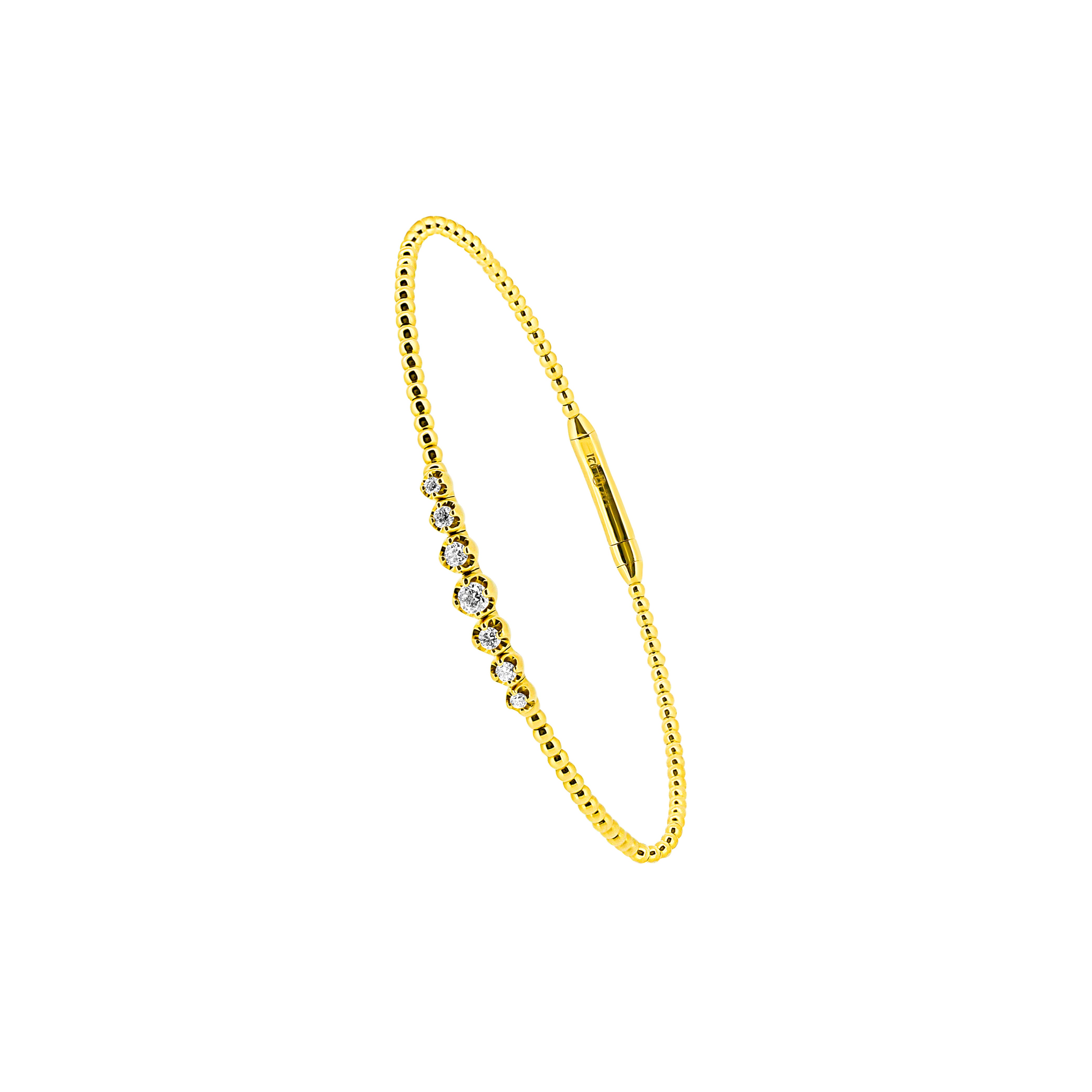 14 Karat Yellow Gold Flexible Bangle with Bezel set Diamonds