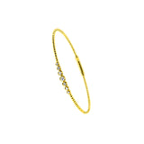 14 Karat Yellow Gold Flexible Bangle with Bezel set Diamonds