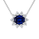 14 Karat White Gold Halo Necklace With A Blue Sapphire And Diamonds