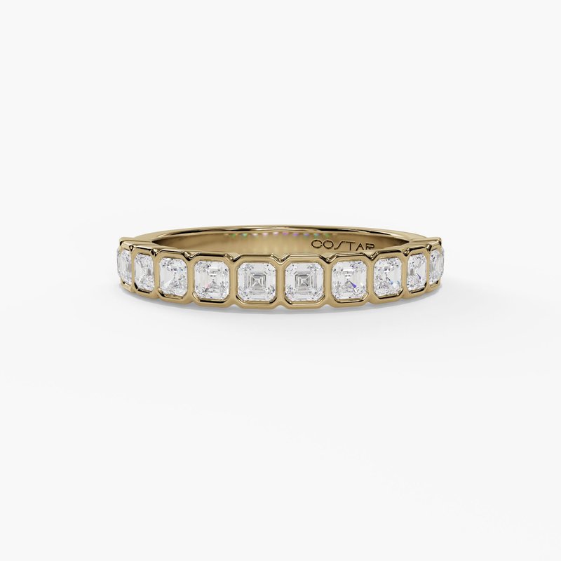 14 karat yellow gold ring with bezel set oval diamonds