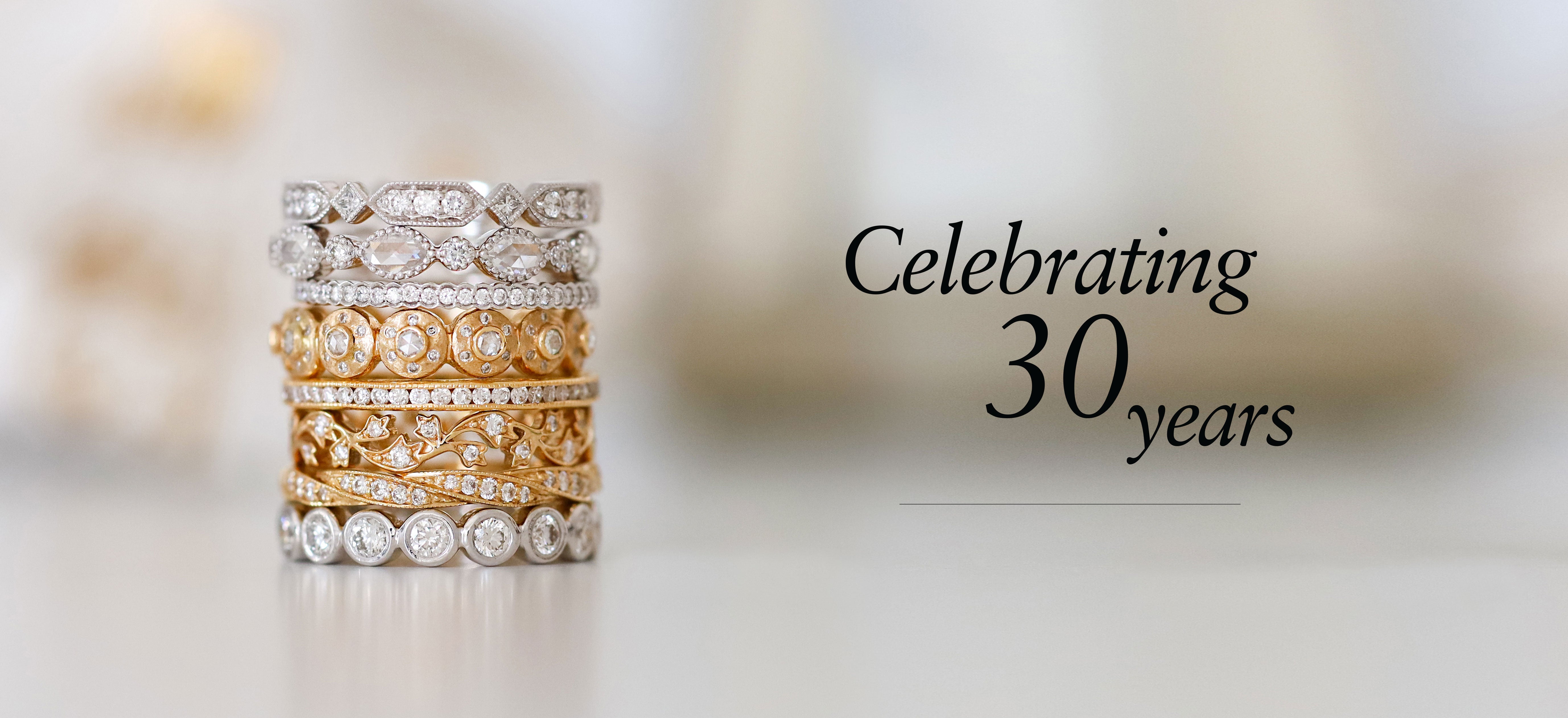 A gold wedding ring engraved with "Celebrating 30 years" to mark a milestone anniversary