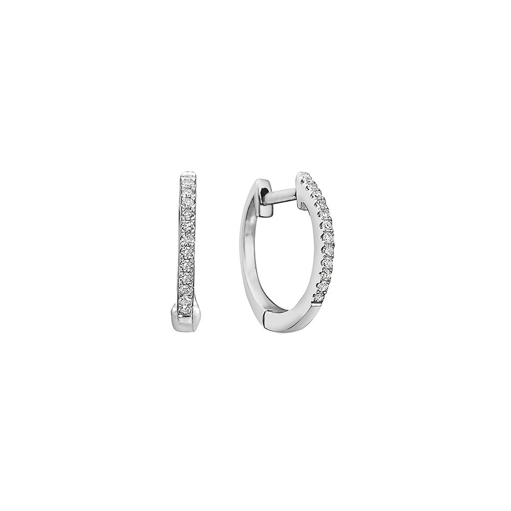 A Pair Of 14 Karat White Gold Huggies With White Diamonds, Perfect For Adding A Touch Of Sophistication To Any Outfit.