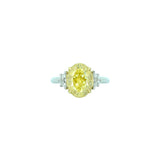 18 Karat White and Yellow Gold Three Stone Ring with Oval Cut Fancy Yellow Diamond and white Half moon diamonds