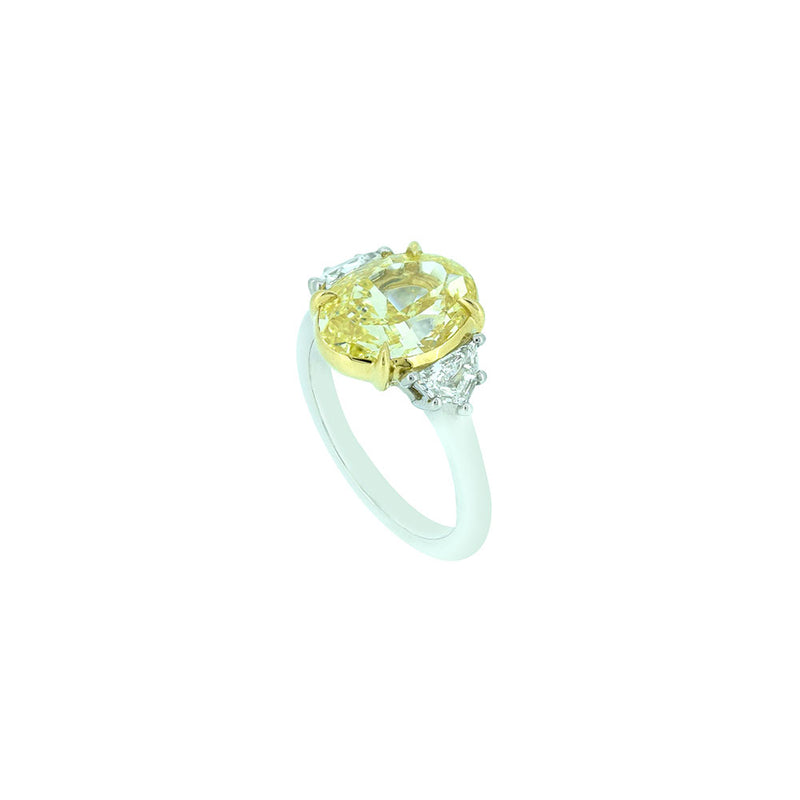 18 Karat White and Yellow Gold Three Stone Ring with Oval Cut Fancy Yellow Diamond and white Half moon diamonds