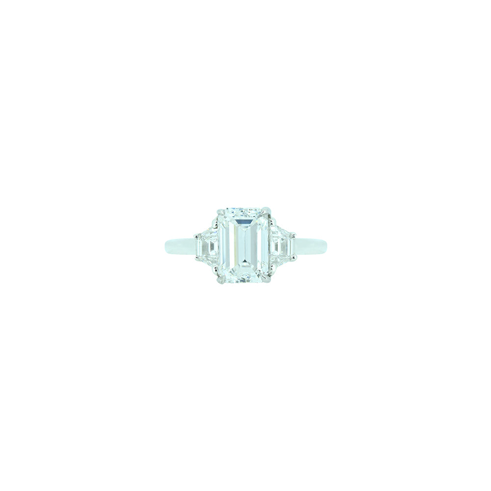 18 Karat White Gold 3 Stone Ring with GIA Emerald Cut Diamond and Side Trapezoid Diamonds