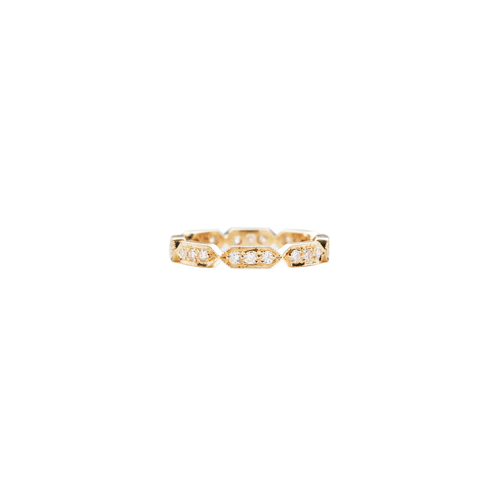 A gold ring with a small diamond, showcasing elegance and luxury.