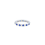 18 KARAT WHITE GOLD ETERNITY BAND WITH BLUE SAPPHIRE AND DIAMONDS