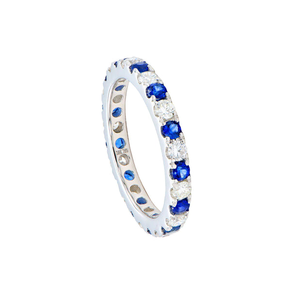18 KARAT WHITE GOLD ETERNITY BAND WITH BLUE SAPPHIRE AND DIAMONDS